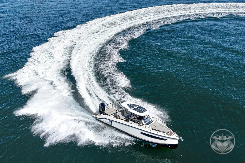 Slide: The Image of 2025 Navan S30 boat making a sharp turn on open water, creating a dynamic wake. - 3