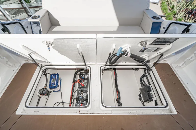 Slide: The Image of Navan S30 2025 boat storage compartments with electrical components and wiring. - 34