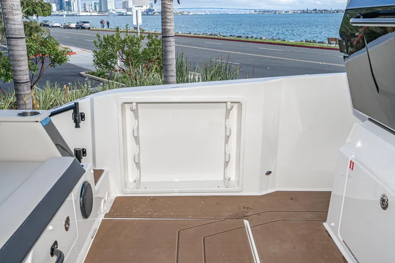 Slide: The Image of Navan S30 2025 boat deck with ocean view and cityscape in the background. - 36