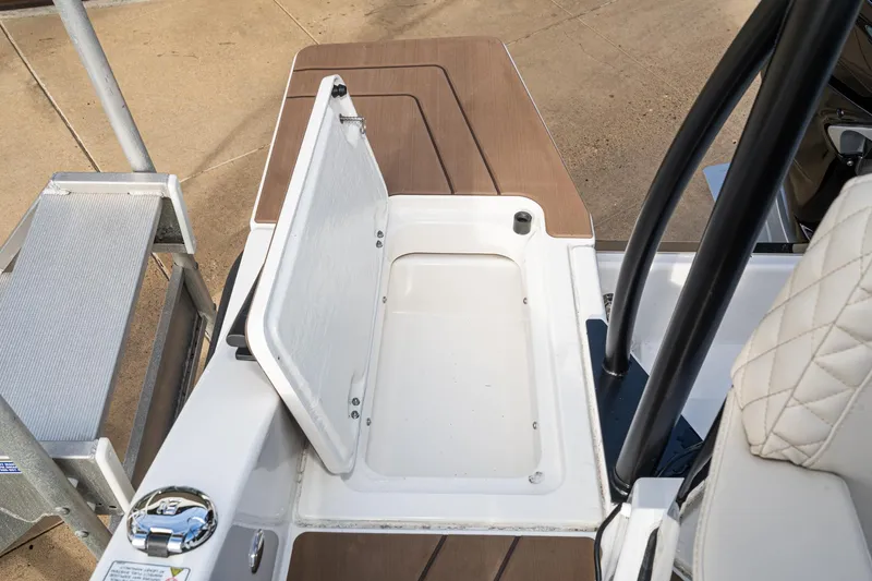 Slide: The Image of Navan S30 2025 boat deck with open storage compartment and seating area. - 42