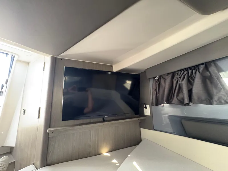 Slide: The Image of Interior of 2025 Navan S30 featuring a mounted flat-screen TV and modern furnishings. - 10