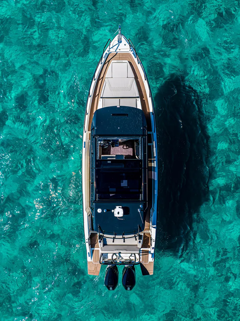 Slide: The Image of Aerial view of 2025 Navan S30 yacht on clear turquoise water. - 17