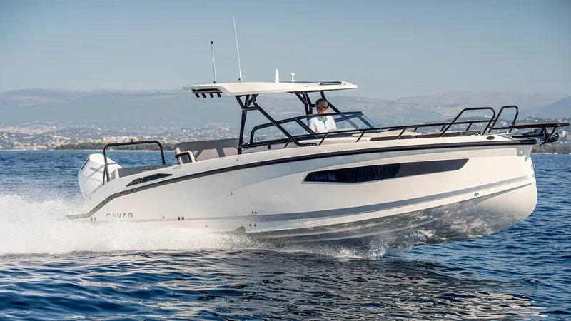 Slide: The Image of Navan S30 2025 motorboat cruising on open water, sleek design, sunny day. - 19