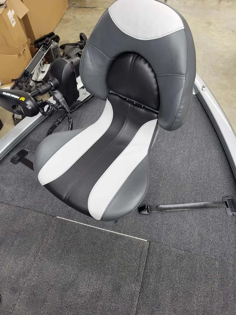 Slide: The Image of 2023 Vexus AVX1880 boat seat with black and white design on carpeted deck. - 19