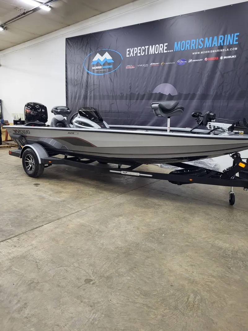 Slide: The Image of 2023 Vexus AVX1880 boat displayed indoors at Morris Marine showroom. - 3