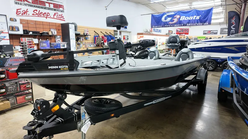 Slide: The Image of 2023 Vexus AVX1880 boat displayed in showroom with fishing gear. - 4