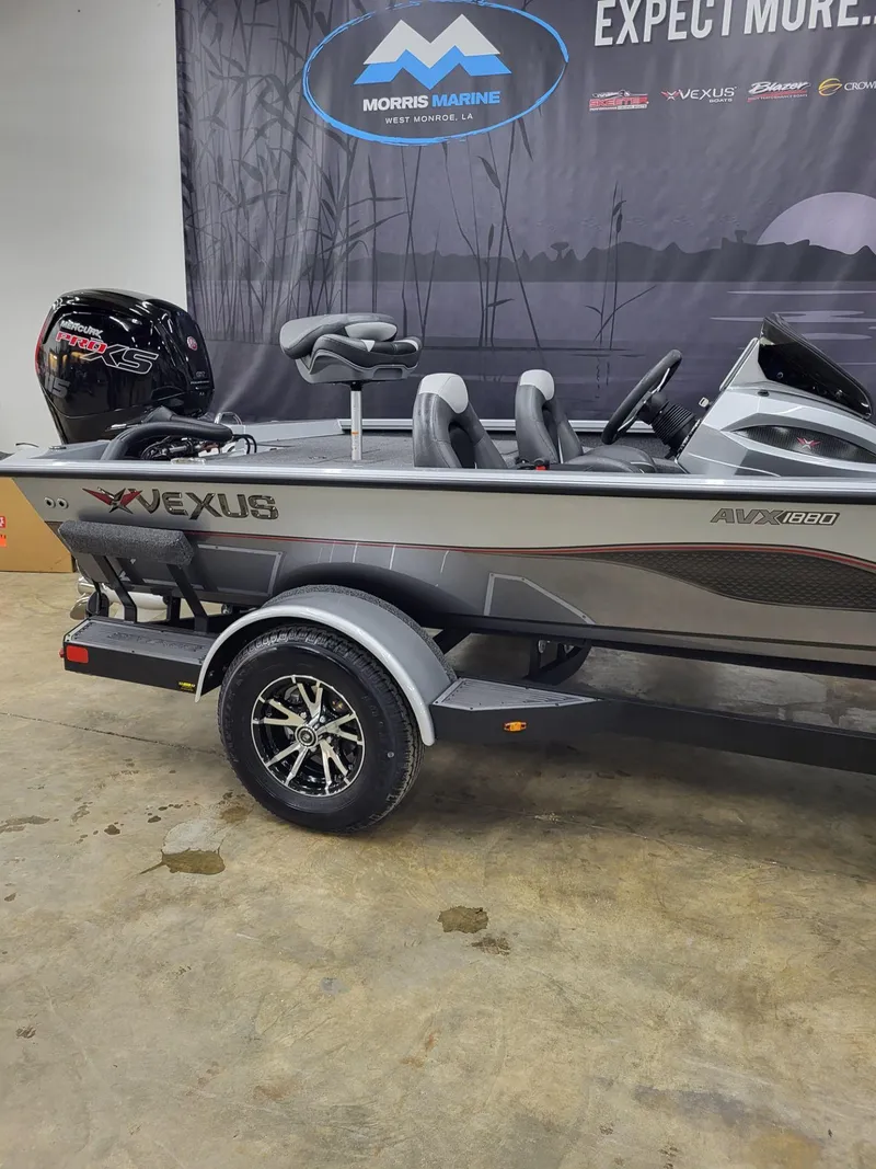 Slide: The Image of 2023 Vexus AVX1880 boat on display in showroom with sleek design and modern features. - 5