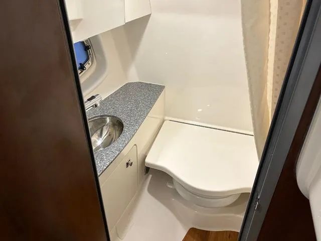 Slide: The Image of 2021 Chaparral 347 SSX boat bathroom with sink and toilet. - 18