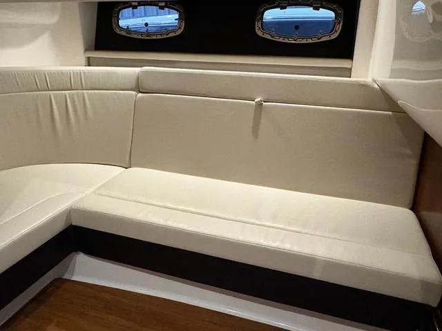 Slide: The Image of Interior seating of 2021 Chaparral 347 SSX boat with beige upholstery. - 19