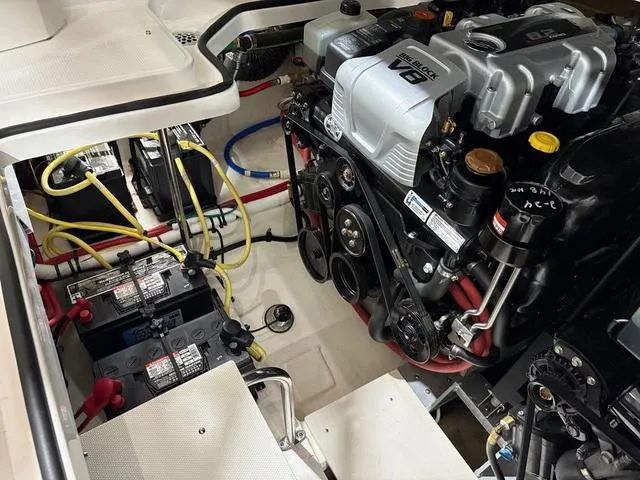 Slide: The Image of Engine compartment of 2021 Chaparral 347 SSX boat with visible batteries and wiring. - 26