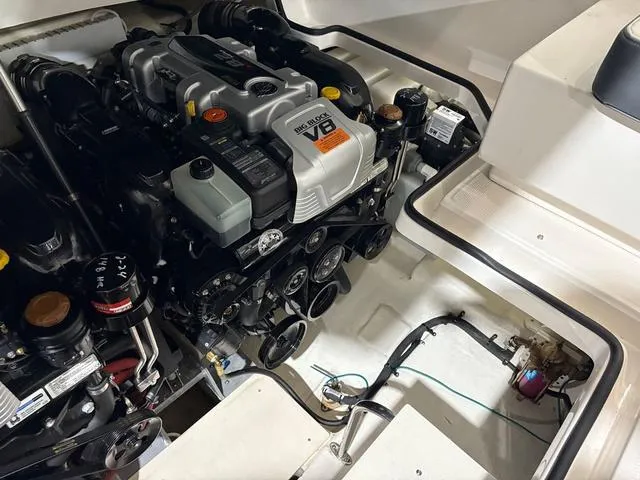 Slide: The Image of Engine compartment of 2021 Chaparral 347 SSX boat, featuring a powerful V8 engine. - 27