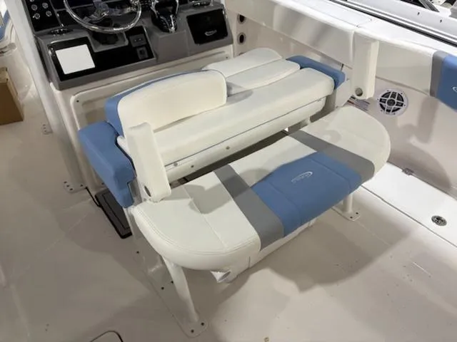 Slide: The Image of 2024 Robalo R250 boat dashboard with steering wheel and control panel. - 3