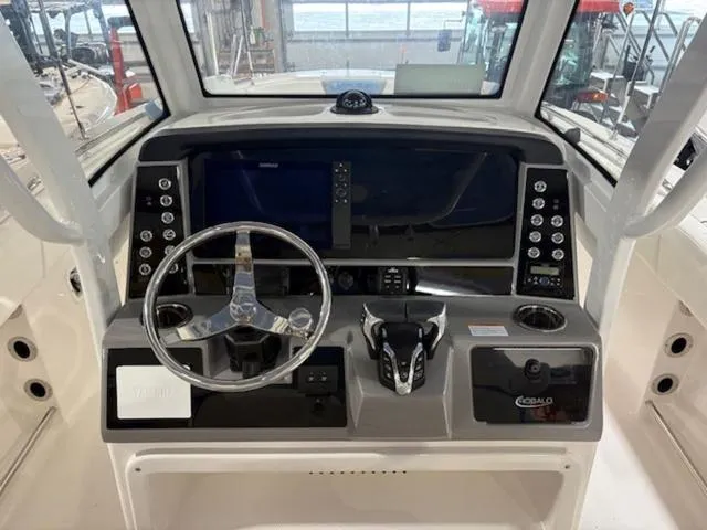 Slide: The Image of 2024 Robalo R250 boat interior, featuring white seating and sleek design elements. - 4