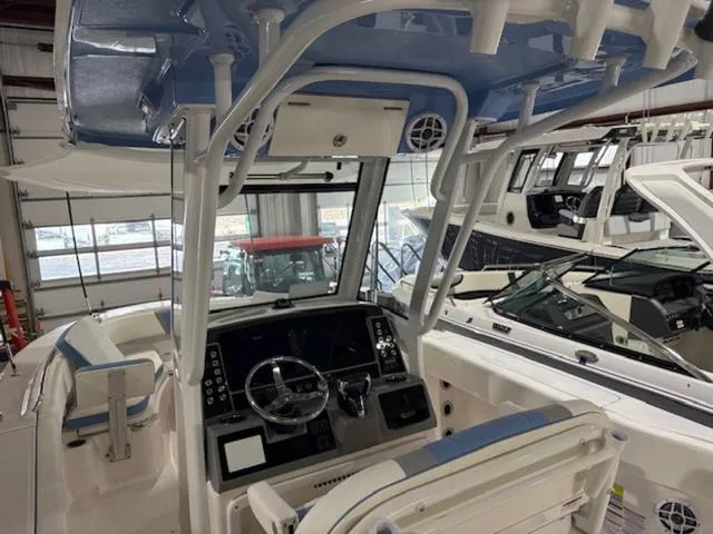 Slide: The Image of 2024 Robalo R250 boat interior with compact marine toilet. - 5