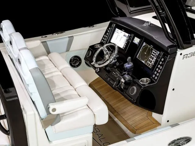 Slide: The Image of 2024 Robalo R360 boat cockpit with advanced navigation system and luxurious seating. - 5