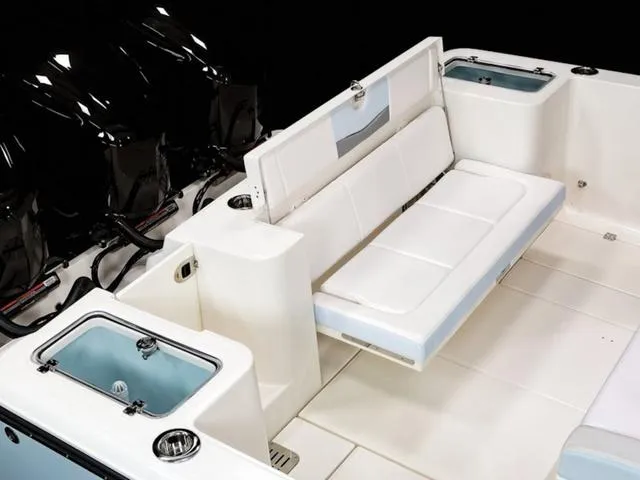 Slide: The Image of 2024 Robalo R360 boat interior with seating and storage compartments. - 7