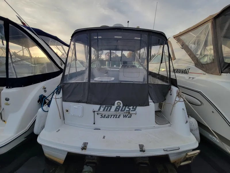 Slide: The Image of 1997 Larson 290 Cabrio boat docked, rear view with canopy, Seattle, WA. - 12