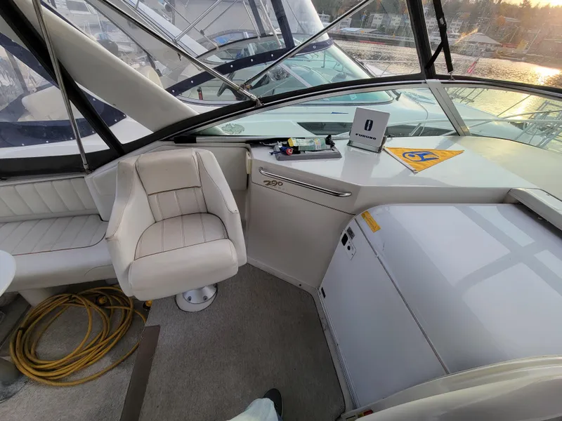 Slide: The Image of Interior of 1997 Larson 290 CABRIO boat with seating and control panel. - 18