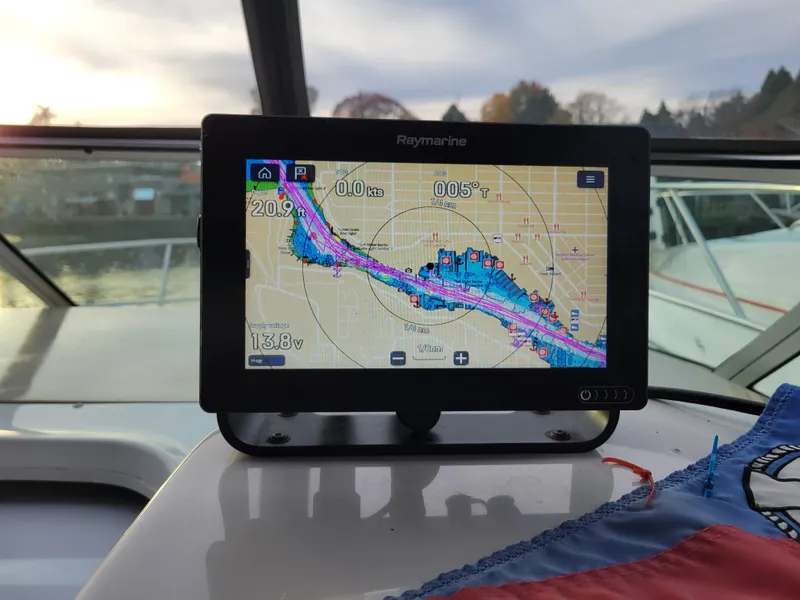 Slide: The Image of Raymarine navigation system on 1997 Larson 290 Cabrio boat dashboard. - 22