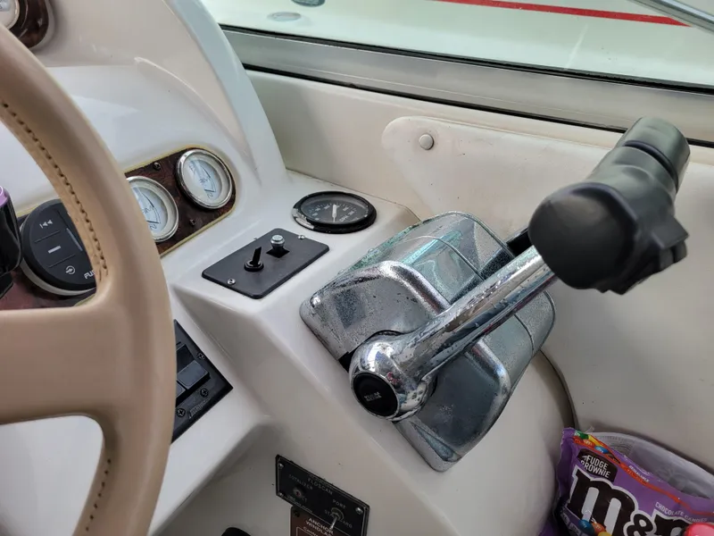 Slide: The Image of 1997 Larson 290 Cabrio boat controls and dashboard with gauges. - 24
