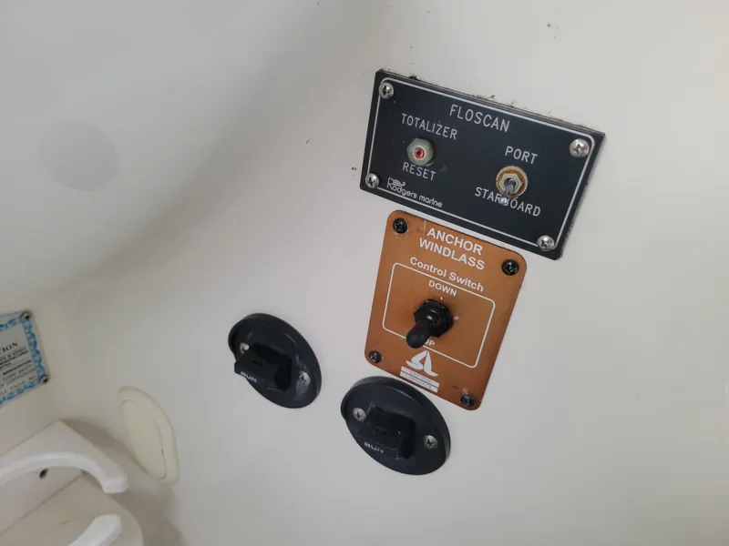 Slide: The Image of Control panel of a 1997 Larson 290 Cabrio boat with anchor windlass switch. - 25