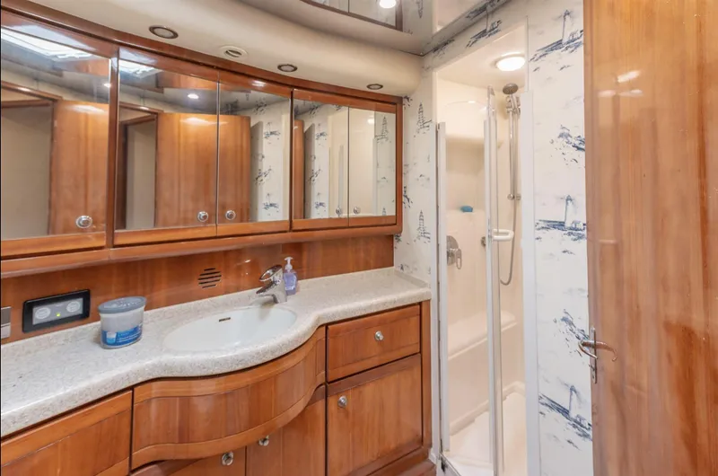 Slide: The Image of Luxurious bathroom in 2004 Bertram 630 yacht with wood cabinetry and shower. - 10