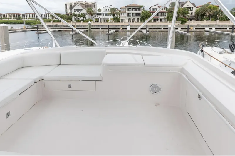 Slide: The Image of Spacious deck of 2004 Bertram 630 yacht docked at marina. - 13