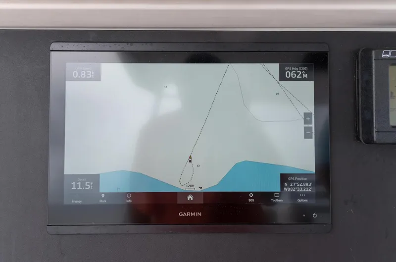 Slide: The Image of Garmin navigation display on 2004 Bertram 630 yacht, showing nautical chart and coordinates. - 19
