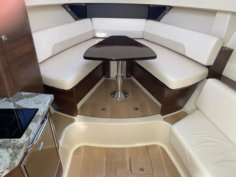 Slide: The Image of Interior of 2020 Boston Whaler 345 Conquest with elegant seating and table. - 17