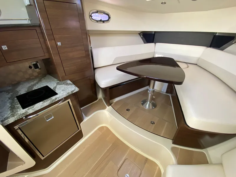 Slide: The Image of Luxurious interior of 2020 Boston Whaler 345 Conquest with modern kitchen and seating area. - 19
