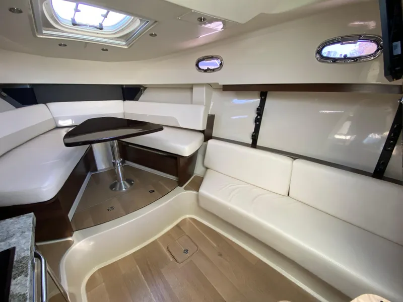 Slide: The Image of Luxurious interior of 2020 Boston Whaler 345 Conquest with plush seating and elegant table. - 21