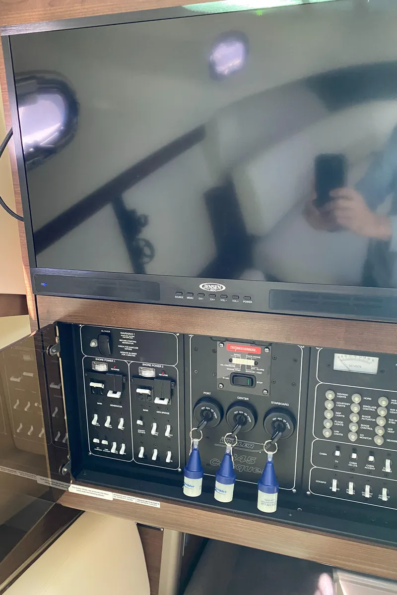 Slide: The Image of Control panel and screen inside 2020 Boston Whaler 345 Conquest boat. - 23