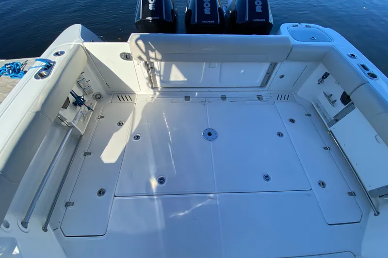 Slide: The Image of 2020 Boston Whaler 345 Conquest boat deck with spacious seating and storage. - 4