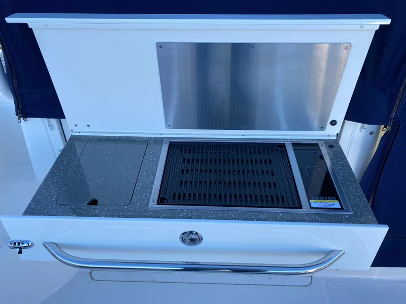 Slide: The Image of Outdoor grill station on 2020 Boston Whaler 345 Conquest boat. - 7