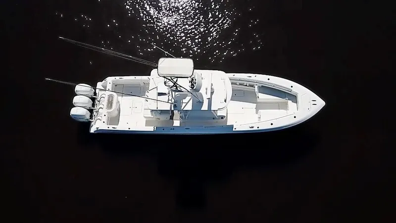 Slide: The Image of Aerial view of 2020 Invincible 39 Open Fisherman boat on dark water. - 12