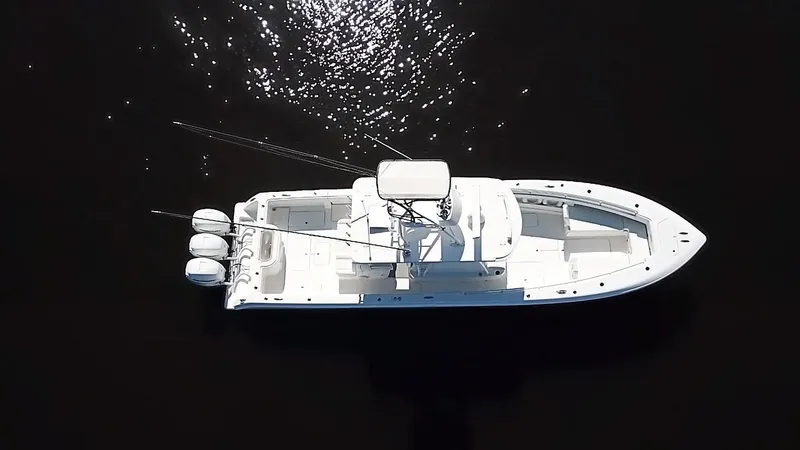 Slide: The Image of Aerial view of 2020 Invincible 39 Open Fisherman boat on dark water. - 13