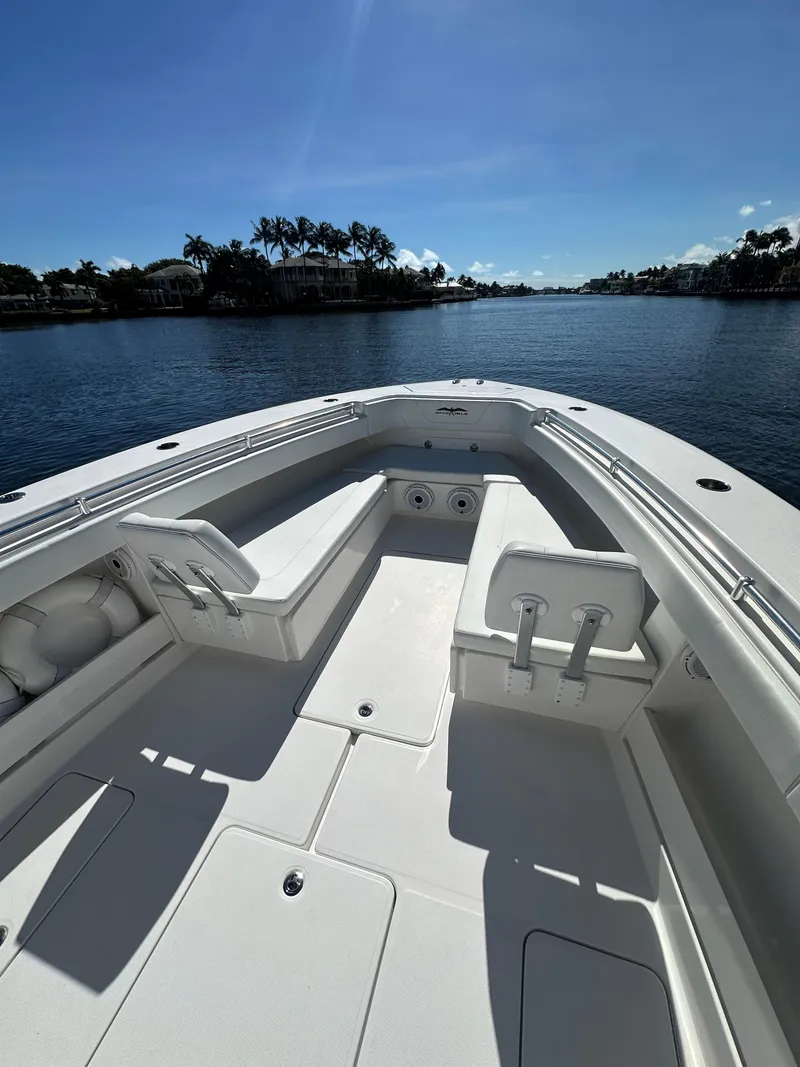 Slide: The Image of 2020 Invincible 39 Open Fisherman boat on calm water, sunny day. - 14