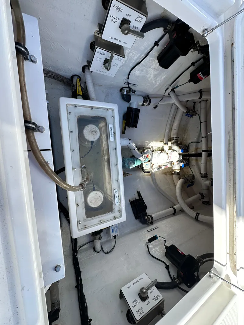 Slide: The Image of 2020 Invincible 39 Open Fisherman boat interior with electrical components and wiring. - 19