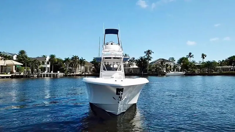 Slide: The Image of 2020 Invincible 39 Open Fisherman boat on calm water, front view. - 6
