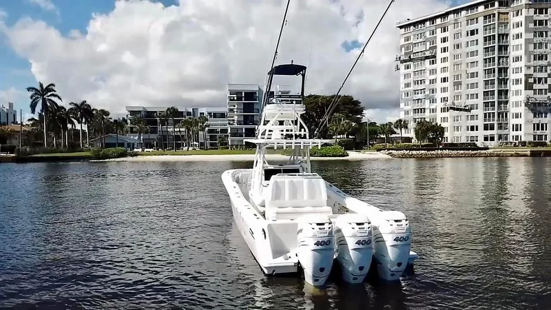 Slide: The Image of 2020 Invincible 39 Open Fisherman boat on water, with triple outboard engines. - 9