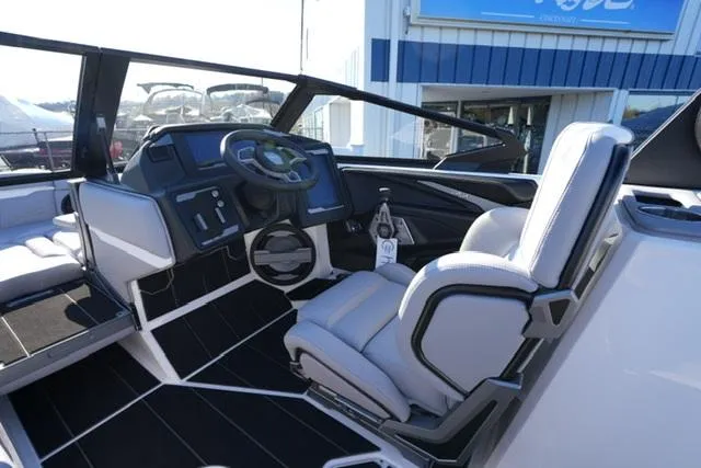 Slide: The Image of 2025 Supra SV 400 boat interior with modern dashboard and seating. - 10