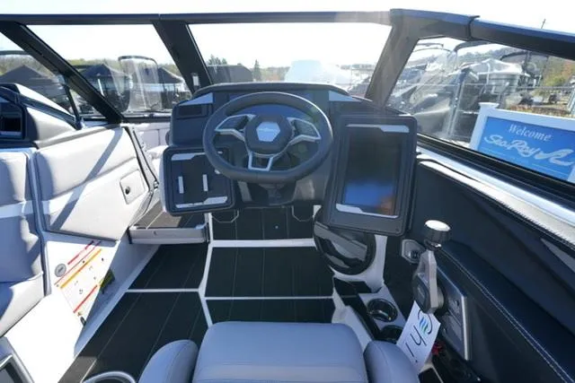 Slide: The Image of 2025 Supra SV 400 boat interior with modern dashboard and steering wheel. - 11