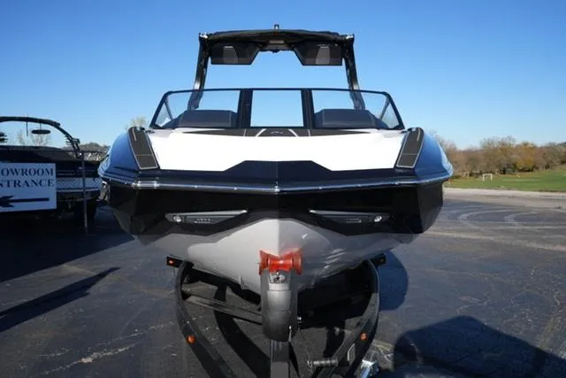 Slide: The Image of 2025 Supra SV 400 boat front view on trailer, outdoors. - 3