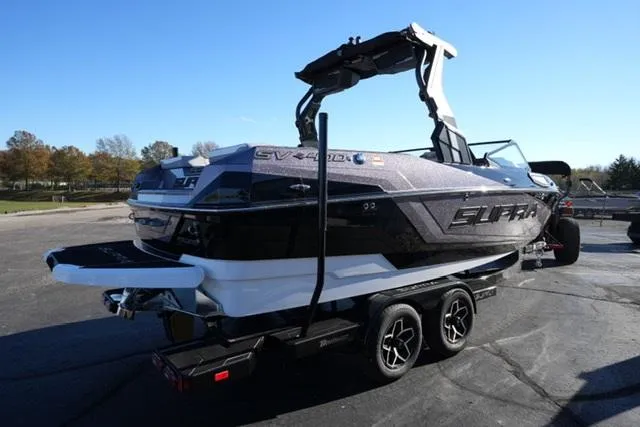 Slide: The Image of 2025 Supra SV 400 boat on trailer, sleek design, parked outdoors. - 5