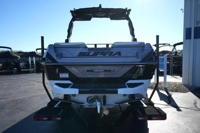 Slide: The Image of 2025 Supra SV 400 boat rear view in a sunny outdoor setting. - 6