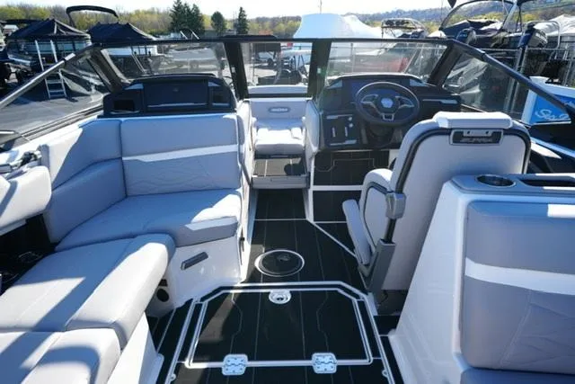 Slide: The Image of 2025 Supra SV 400 boat interior with modern seating and steering console. - 9