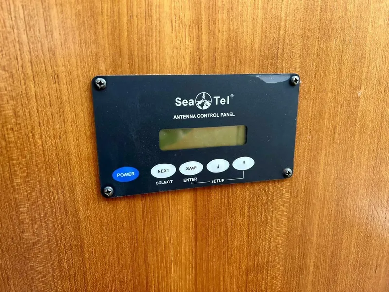 Slide: The Image of Sea Tel antenna control panel on 1997 Tiara Yachts 41, mounted on wooden surface. - 15