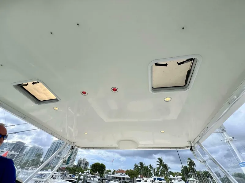 Slide: The Image of Tiara Yachts 41, 1997 model, boat ceiling with hatches and lights, marina view. - 19