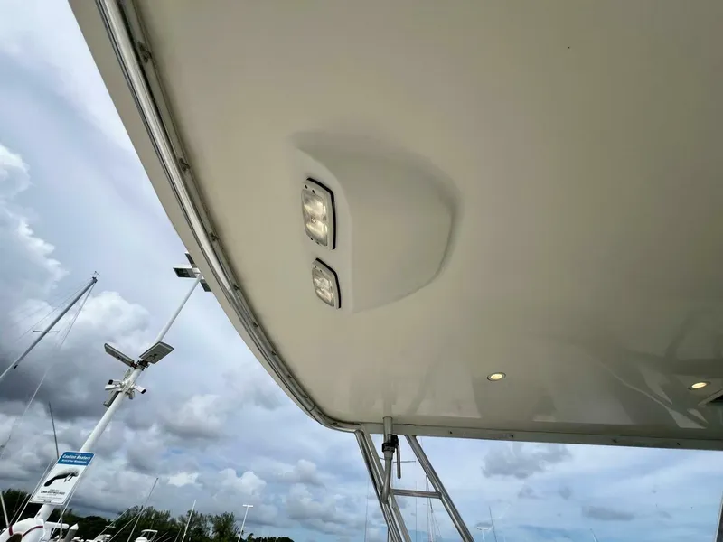 Slide: The Image of Tiara Yachts 41, 1997 model, boat canopy with lights, cloudy sky background. - 20