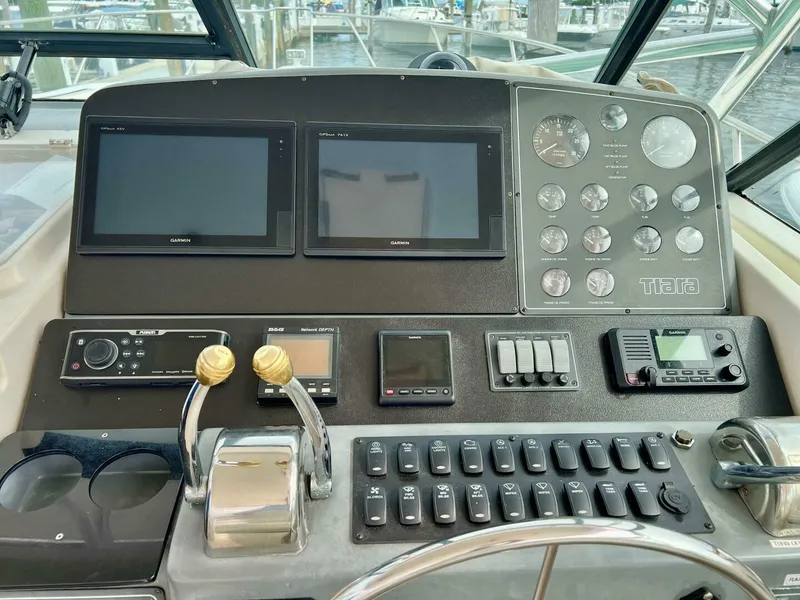 Slide: The Image of Control panel of a 1997 Tiara Yachts 41 with navigation and communication equipment. - 21